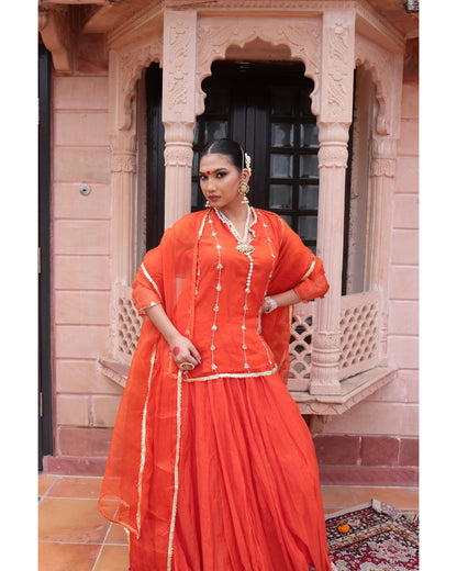 Orange Organza Kurti Paired with Chanderi Lehenga