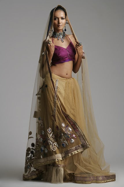 Elegant Beige Lehenga paired with a rich Wine-colored Blouse